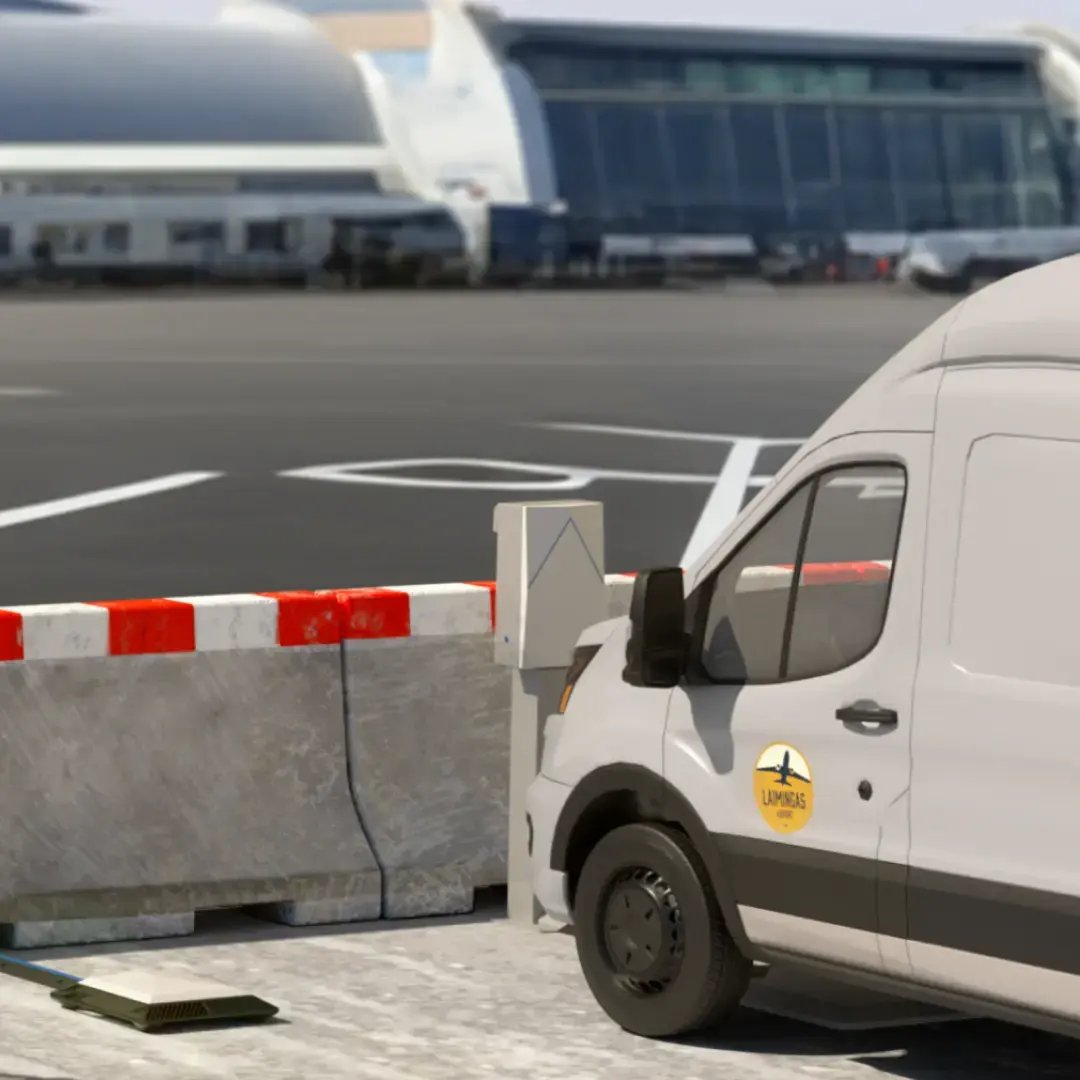 A white van charges wirelessly in a fleet lot overlooking the tarmac of a small airport
